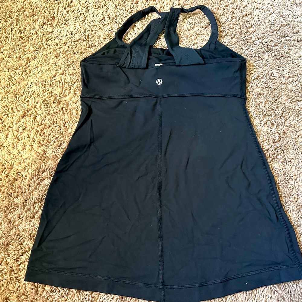 Lululemon black yoga top with built in bra, size 4.